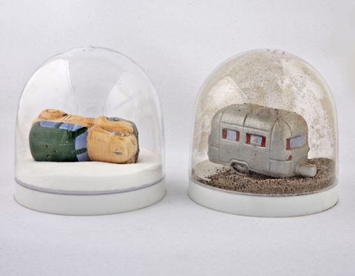 SHAKE: AN ACCUMULATED GIFT COLLECTION OF SALT AND PEPPER SHAKERS <br/>
1991 Ongoing <br/>
Detail: Gift of Luis Macias (Station Wagon and Trailer Bought From Andrea Zittel)<br/>
Snow Globes Altered to Become Functioning Salt and Pepper Shakers, Each Filled with Salt and Pepper, and when Used, the Diminishing Salt and Pepper Reveals the Actual Accumulated Gift Collection of Shakers<br/>