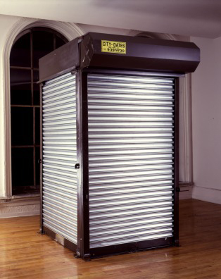 Security Kiosk: Tony, Tom, and Devo; 508 Broadway<br />
1990<br />
Three Dimensional Security Gate Installation with 3 Gates and 2 Sheets of Galvanized Steel<br />
103”  x 55”  x 55”  <br />