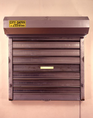 Security/Peekaboo<br />
1990<br />
Security Gate Installation Backlit with Incandescent Lights<br />
60”  x 65” <br />