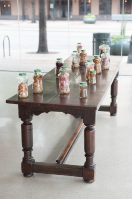 PRETTY PLEASE<br />
2011 Ongoing<br />
Installation View<br />
Table: 16 Pace Picante Jars Holding the Potpourri Made from the Blossoms of the 16 Flower Bouquets Used to Replicate Each of the Last 16 Edouard Manet Painted Before Dying, Displayed on a 19th Century English Table<br />
Variable Dimensions<br />