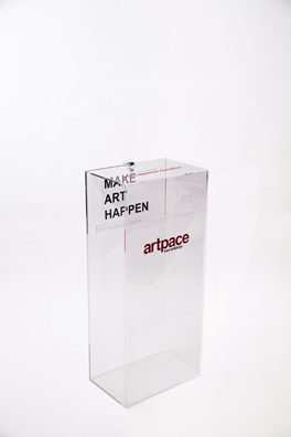 “PAY WHAT YOU WISH BUT YOU MUST PAY SOMETHING”<br />
2013 Ongoing<br />
Floor: One of 18 Functioning American Art Museum Donation Boxes replicated and Displayed at an Art Fair in Various Positions throughout the Fair<br />
Artpace<br />
Variable Dimensions<br />