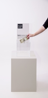 “PAY WHAT YOU WISH BUT YOU MUST PAY SOMETHING”<br />
2013 Ongoing<br />
Floor: One of 18 Functioning American Art Museum Donation Boxes replicated and Displayed at an Art Fair in Various Positions throughout the Fair<br />
Bass Museum of Art<br />
Variable Dimensions<br />