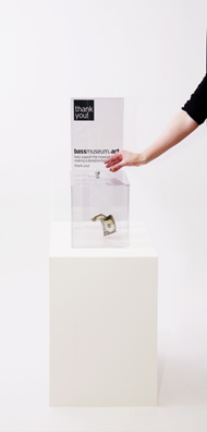 “PAY WHAT YOU WISH BUT YOU MUST PAY SOMETHING”<br />
2013 Ongoing<br />
Floor: One of 18 Functioning American Art Museum Donation Boxes replicated and Displayed at an Art Fair in Various Positions throughout the Fair<br />
Bass Museum of Art<br />
Variable Dimensions<br />