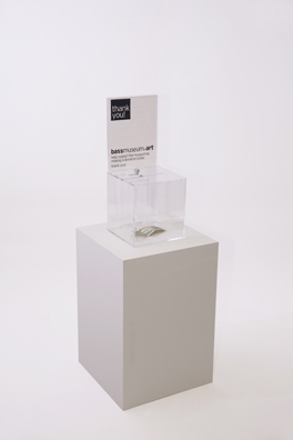“PAY WHAT YOU WISH BUT YOU MUST PAY SOMETHING”<br />
2013 Ongoing<br />
Floor: One of 18 Functioning American Art Museum Donation Boxes replicated and Displayed at an Art Fair in Various Positions throughout the Fair<br />
Bass Museum of Art<br />
Variable Dimensions<br />