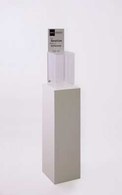 “PAY WHAT YOU WISH BUT YOU MUST PAY SOMETHING”<br />
2013 Ongoing<br />
Floor: One of 18 Functioning American Art Museum Donation Boxes replicated and Displayed at an Art Fair in Various Positions throughout the Fair<br />
Boulder Museum of Contemporary Art<br />
Variable Dimensions<br />
