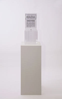 “PAY WHAT YOU WISH BUT YOU MUST PAY SOMETHING”<br />
2013 Ongoing<br />
Floor: One of 18 Functioning American Art Museum Donation Boxes replicated and Displayed at an Art Fair in Various Positions throughout the Fair<br />
NADA Art Fair<br />
Variable Dimensions<br />