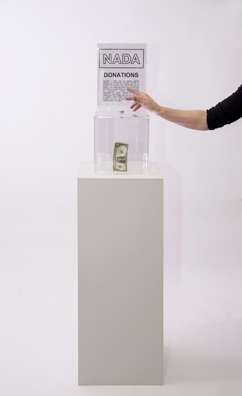 “PAY WHAT YOU WISH BUT YOU MUST PAY SOMETHING”<br />
2013 Ongoing<br />
Floor: One of 18 Functioning American Art Museum Donation Boxes replicated and Displayed at an Art Fair in Various Positions throughout the Fair<br />
NADA Art Fair<br />
Variable Dimensions<br />