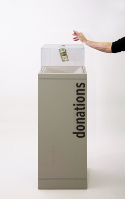 “PAY WHAT YOU WISH BUT YOU MUST PAY SOMETHING”<br />
2013 Ongoing<br />
Floor: One of 18 Functioning American Art Museum Donation Boxes replicated and Displayed at an Art Fair in Various Positions throughout the Fair<br />
The Nelson-Atkins Museum of Art<br />
Variable Dimensions<br />