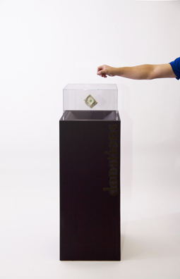 “PAY WHAT YOU WISH BUT YOU MUST PAY SOMETHING”<br />
2013 Ongoing<br />
Floor: One of 18 Functioning American Art Museum Donation Boxes replicated and Displayed at an Art Fair in Various Positions throughout the Fair<br />
The Nelson-Atkins Museum of Art<br />
Variable Dimensions<br />