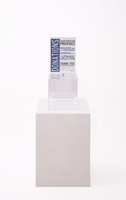 “PAY WHAT YOU WISH BUT YOU MUST PAY SOMETHING”<br />
2013 Ongoing<br />
Floor: One of 18 Functioning American Art Museum Donation Boxes replicated and Displayed at an Art Fair in Various Positions throughout the Fair<br />
Museum of Contemporary Art, North Miami<br />
Variable Dimensions<br />