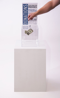 “PAY WHAT YOU WISH BUT YOU MUST PAY SOMETHING”<br />
2013 Ongoing<br />
Floor: One of 18 Functioning American Art Museum Donation Boxes replicated and Displayed at an Art Fair in Various Positions throughout the Fair<br />
Museum of Contemporary Art, North Miami<br />
Variable Dimensions<br />