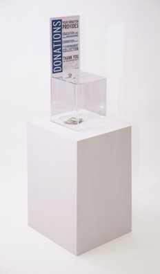 “PAY WHAT YOU WISH BUT YOU MUST PAY SOMETHING”<br />
2013 Ongoing<br />
Floor: One of 18 Functioning American Art Museum Donation Boxes replicated and Displayed at an Art Fair in Various Positions throughout the Fair<br />
Museum of Contemporary Art, North Miami<br />
Variable Dimensions<br />