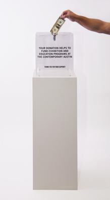 “PAY WHAT YOU WISH BUT YOU MUST PAY SOMETHING”<br />
2013 Ongoing<br />
Floor: One of 18 Functioning American Art Museum Donation Boxes replicated and Displayed at an Art Fair in Various Positions throughout the Fair<br />
The Contemporary Austin<br />
Variable Dimensions<br />