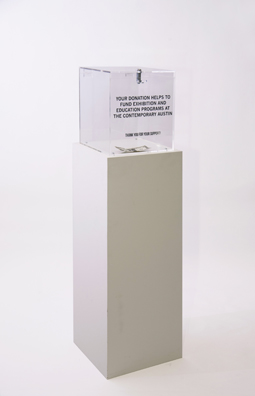 “PAY WHAT YOU WISH BUT YOU MUST PAY SOMETHING”<br />
2013 Ongoing<br />
Floor: One of 18 Functioning American Art Museum Donation Boxes replicated and Displayed at an Art Fair in Various Positions throughout the Fair<br />
The Contemporary Austin<br />
Variable Dimensions<br />