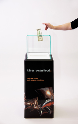 “PAY WHAT YOU WISH BUT YOU MUST PAY SOMETHING”<br />
2013 Ongoing<br />
Floor: One of 18 Functioning American Art Museum Donation Boxes replicated and Displayed at an Art Fair in Various Positions throughout the Fair<br />
Andy Warhol Museum<br />
Variable Dimensions<br />