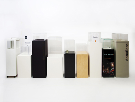 “PAY WHAT YOU WISH BUT YOU MUST PAY SOMETHING”<br />
2013 Ongoing<br />
Floor: Nine of 18 Functioning American Art Museum Donation Boxes replicated and Displayed at an Art Fair in Various Positions throughout the Fair<br />
Museum of Contemporary Art San Diego, Museum of Contemporary Art San Diego, Bass Museum of Art, The Nelson-Atkins Museum of Art, Museum of Contemporary Art Denver, Clyfford Still Museum, Aspen Art Museum, Andy Warhol Museum, The Nelson-Atkins Museum of Art<br />
Variable Dimensions<br />