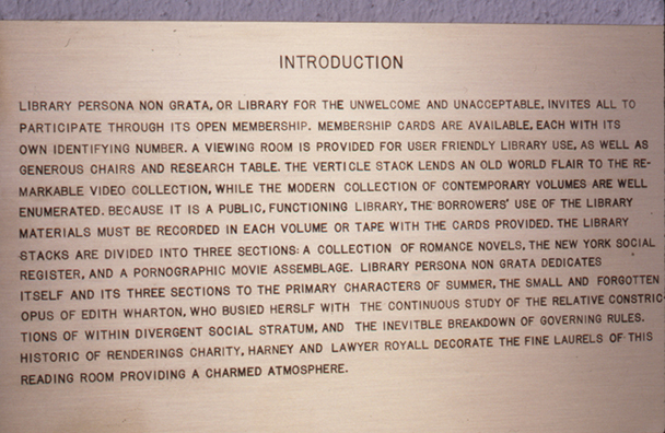 LIBRARY PERSONA NON GRATA<br />
1993<br />
Detail: brass informational sign <br />
the introduction to Library Persona Non Grata <br />