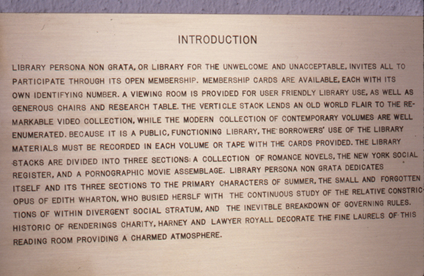 LIBRARY PERSONA NON GRATA<br />
1993<br />
Detail: brass informational sign <br />
the introduction to Library Persona Non Grata <br />