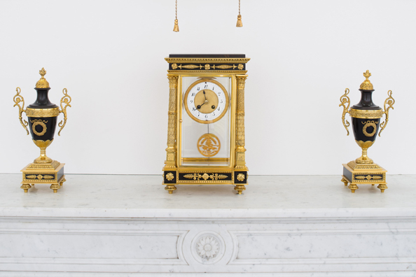 TRICIA NIXON: SUMMER OF 1973 <br/>
2017 Ongoing <br/>
Antique Marble Fireplace, Clock, and Urns <br/>
Variable Dimensions <br/>