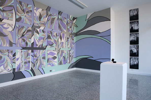 MARILYN MONROE WANTED TO BE BURIED IN PUCCI <br />
2008 Ongoing <br />
White Wall: 5 (DiMaggio's Yankee Number) Black & White Cibachromes of the<br /> Flag at Half Mast the Day Joe DiMaggio Died <br />
Mounted in Aluminum with Non-Glare Plexiglas, Installed Vertically<br/>
15” x 23” Each<br />
Patterned Wall: 36 (The Age of Monroe when She Died) Watercolors of a Pucci<br /> Dress Installed on a Wall Mural of the Same Pattern<br />
24” x 36” Each<br />
Podium: Replica of the Eternity Ring Given by DiMaggio to Monroe on the<br /> Occasion of their Marriage<br />
Provided by Tiffany & Co and Left for Viewers to Try on<br /> 
Variable Dimensions<br />
Unique<br />