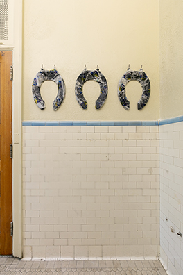 HORSESHOES, HAND GRENADES, AND DANCING<br />
2020 Ongoing<br />
Series of 3 Toilet Seats, Wrapped in Scott Toilet Paper Packaging, Mounted on Wall of Men’s Bathroom<br />
Variable Dimensions