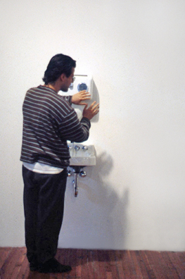 “COME YOU SPIRITS, WHICH TEND ON MORTAL THOUGHTS” - <i> Macbeth, </i> Shakespeare<br />
1993 Ongoing<br />
Happening: Functioning Kohler Sink, Soap Dispenser, and Air Dryer Installed in Gallery and Being Used by Kenny Schachter to Soap, Wash, and Dry His Hands <br />
Photograph of Happening<br />
Variable Dimensions <br />