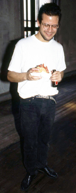 “ONE LITTLE PIGGY ATE ROAST BEEF, ONE LITTLE PIGGY HAD NONE” <br />
1991 Ongoing<br />
Happening: 100 Pounds of Roast Beef, Sliced, Served in Sandwiches, and Consumed in Variable Dimensions <br />
Photograph of Happening: Kenny Schachter Examining the Fare, and Thinking about Pepcid AC<br />