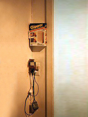 <i> PRIDE AND PREJUDICE </i> (After Jane Austen)<br />
1994<br />
Happening: “The Clapper, As Seen on TV”, Installed in Gallery of Group Show and Left for Viewers to “Clap On” and “Clap Off” Various Lighting Fixtures <br />
Variable Dimensions<br />
Photograph of Installation of “The Clapper”<br />
Unique, 1 AP<br />