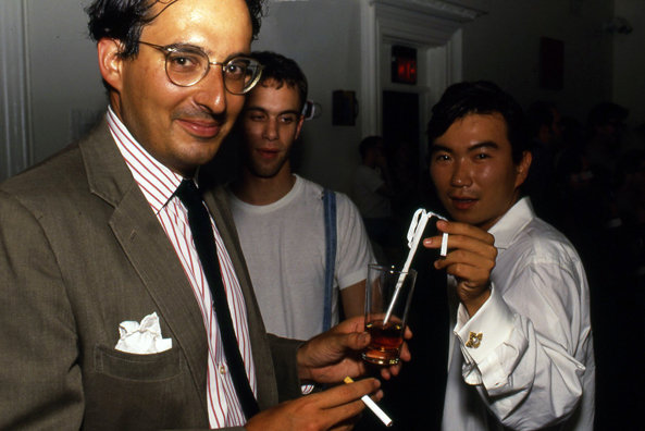 SUCK<br />
1991 Ongoing<br />
Happening: Plastic Straws with Fancy Handmade Paper Tops Served in All Drinks at Various Art Fairs and Art Openings, Displayed in Bouquets in Bar Area, and as Relics<br />
Series of 10 “Straw Bouquets”, 500 Individual Straws/Bouquet<br />
Photograph of Happening NY: Jeffrey Podolsky and Khoi Nguyen Thoroughly Enjoy the Days When “Smoking Is Legal, and Drinking Is a Gentlemanly Virtue”<br />
Edition: 2, 1 AP<br />