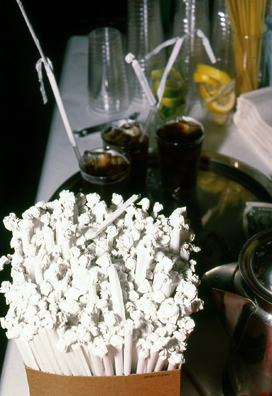 SUCK<br />
1991 Ongoing<br />
Happening: Plastic Straws with Fancy Handmade Paper Tops Served in All Drinks at Various Art Fairs and Art Openings, Displayed in Bouquets in Bar Area, and as Relics<br />
Series of 10 “Straw Bouquets”, 500 Individual Straws/Bouquet<br />
Photograph of Happening NY: Cuba Libre, Que Rico!<br />
Edition: 2, 1 AP<br />