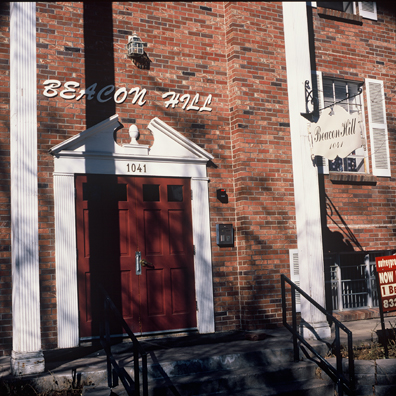 DISPLACED DENVER: THE BEACON HILL <br/>
2000 Ongoing <br/>
Cibachrome Print <br/>
Series of Denver Apartment Buildings Named After Famous Politicians, Artists, Landmarks, Neighborhoods, Beaches, Styles, Museums, Islands, Cocktails, Clothing, Pirates, Warriors, Automobiles, Restaurants, Race Tracks, Festivals, Writers, Cities, Explorers, Teams, Palaces, Stores, Poets, Song Writers, Hotels, Magazines, Fictional Places, Architectural Elements, Holidays, Etc <br/ >