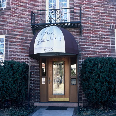 DISPLACED DENVER: THE BENTLEY <br/>
2000 Ongoing <br/>
Cibachrome Print <br/>
Series of Denver Apartment Buildings Named After Famous Politicians, Artists, Landmarks, Neighborhoods, Beaches, Styles, Museums, Islands, Cocktails, Clothing, Pirates, Warriors, Automobiles, Restaurants, Race Tracks, Festivals, Writers, Cities, Explorers, Teams, Palaces, Stores, Poets, Song Writers, Hotels, Magazines, Fictional Places, Architectural Elements, Holidays, Etc <br/ >