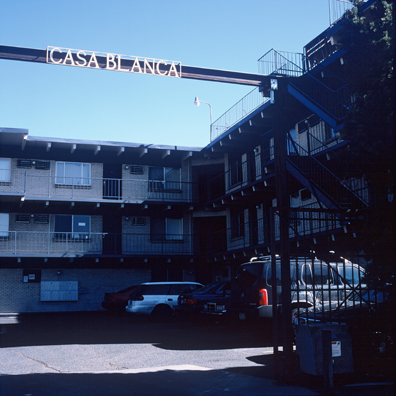 DISPLACED DENVER: THE CASABLANCA<br/>
2000 Ongoing <br/>
Cibachrome Print <br/>
Series of Denver Apartment Buildings Named After Famous Politicians, Artists, Landmarks, Neighborhoods, Beaches, Styles, Museums, Islands, Cocktails, Clothing, Pirates, Warriors, Automobiles, Restaurants, Race Tracks, Festivals, Writers, Cities, Explorers, Teams, Palaces, Stores, Poets, Song Writers, Hotels, Magazines, Fictional Places, Architectural Elements, Holidays, Etc <br/ >