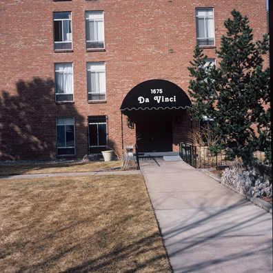 DISPLACED DENVER: THE DA VINCI<br/>
2000 Ongoing <br/>
Cibachrome Print <br/>
Series of Denver Apartment Buildings Named After Famous Politicians, Artists, Landmarks, Neighborhoods, Beaches, Styles, Museums, Islands, Cocktails, Clothing, Pirates, Warriors, Automobiles, Restaurants, Race Tracks, Festivals, Writers, Cities, Explorers, Teams, Palaces, Stores, Poets, Song Writers, Hotels, Magazines, Fictional Places, Architectural Elements, Holidays, Etc <br/ >