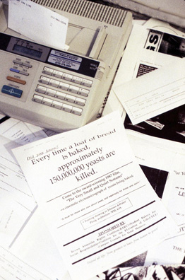 OPEN ART FAX LINE <br/>
1992 Ongoing <br/>
Detail: Every Time a Loaf of Bread is Baked, Approximately 150,000,000 Yeasts Are Killed<br/>
Functioning Independent Fax/Phone Line Installed in Gallery for Duration of the Exhibition and Free/Open to the Public to Fax in Art/Commentary for Scatter Presentation on the Floor <br/>
Machine: 14” x 9” x 6” <br/>
Fax Scattering: Variable Dimensions <br/>