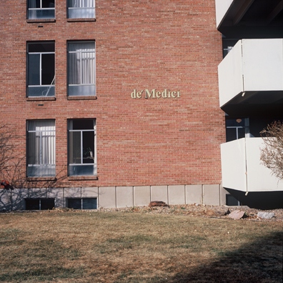 DISPLACED DENVER: THE DE MEDICI<br/>
2000 Ongoing <br/>
Cibachrome Print <br/>
Series of Denver Apartment Buildings Named After Famous Politicians, Artists, Landmarks, Neighborhoods, Beaches, Styles, Museums, Islands, Cocktails, Clothing, Pirates, Warriors, Automobiles, Restaurants, Race Tracks, Festivals, Writers, Cities, Explorers, Teams, Palaces, Stores, Poets, Song Writers, Hotels, Magazines, Fictional Places, Architectural Elements, Holidays, Etc <br/ >
