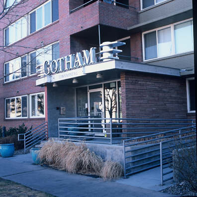 DISPLACED DENVER: THE GOTHAM<br/>
2000 Ongoing <br/>
Cibachrome Print <br/>
Series of Denver Apartment Buildings Named After Famous Politicians, Artists, Landmarks, Neighborhoods, Beaches, Styles, Museums, Islands, Cocktails, Clothing, Pirates, Warriors, Automobiles, Restaurants, Race Tracks, Festivals, Writers, Cities, Explorers, Teams, Palaces, Stores, Poets, Song Writers, Hotels, Magazines, Fictional Places, Architectural Elements, Holidays, Etc <br/ >