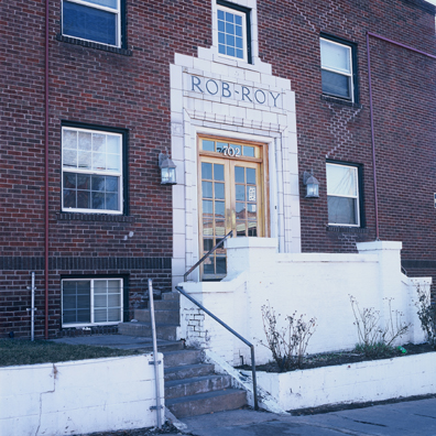 DISPLACED DENVER: THE ROB ROY<br/>
2000 Ongoing <br/>
Cibachrome Print <br/>
Series of Denver Apartment Buildings Named After Famous Politicians, Artists, Landmarks, Neighborhoods, Beaches, Styles, Museums, Islands, Cocktails, Clothing, Pirates, Warriors, Automobiles, Restaurants, Race Tracks, Festivals, Writers, Cities, Explorers, Teams, Palaces, Stores, Poets, Song Writers, Hotels, Magazines, Fictional Places, Architectural Elements, Holidays, Etc <br/ >