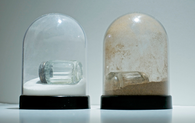 SHAKE: AN ACCUMULATED GIFT COLLECTION OF SALT AND PEPPER SHAKERS <br/>
1991 Ongoing <br/>
Detail: Gift of Mama Sharp (Crystal Shakers with Silver Tops)<br/>
Snow Globes Altered to Become Functioning Salt and Pepper Shakers, Each Filled with Salt and Pepper, and when Used, the Diminishing Salt and Pepper Reveals the Actual Accumulated Gift Collection of Shakers<br/>
3 1/2”H x 2 1/2” in Diameter<br/>