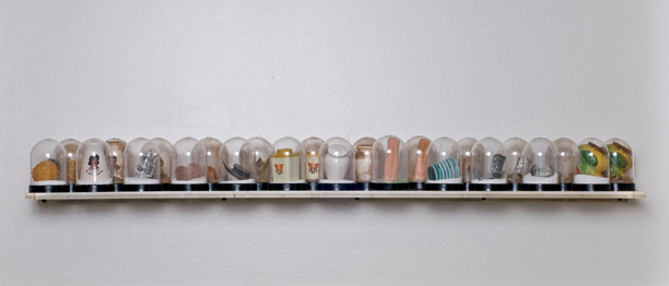 SHAKE: AN ACCUMULATED GIFT COLLECTION OF SALT AND PEPPER SHAKERS <br/>
1991 Ongoing <br/>
Installation View of Entire Collection to Date as of 2010 <br/>
Snow Globes Altered to Become Functioning Salt and Pepper Shakers, Each Filled with Salt and Pepper, and when Used, the Diminishing Salt and Pepper Reveals the Actual Accumulated Gift Collection of Shakers<br/>
3 1/2”H x 2 1/2” in Diameter<br/>
12 Sets in Ongoing Collection <br/>