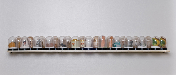 SHAKE: AN ACCUMULATED GIFT COLLECTION OF SALT AND PEPPER SHAKERS <br/>
1991 Ongoing <br/>
Installation View of Entire Collection to Date as of 2010 <br/>
Snow Globes Altered to Become Functioning Salt and Pepper Shakers, Each Filled with Salt and Pepper, and when Used, the Diminishing Salt and Pepper Reveals the Actual Accumulated Gift Collection of Shakers<br/>
3 1/2”H x 2 1/2” in Diameter<br/>
12 Sets in Ongoing Collection <br/>
