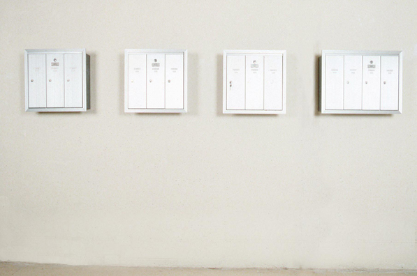 THE MAIL: FANFARE <br/>
1991 Ongoing <br/>
3, 3 Station, 1, 4 Station Functioning Apartment Mailboxes, Each Mailbox Given to an Artist in the Group Show for Their Personal Use for the Duration of the Exhibition<br/>
Variable Dimensions <br/>