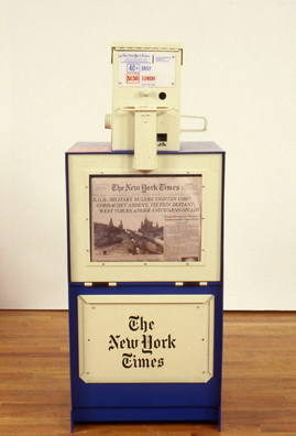 THE NEWS <br/>
1991 Ongoing <br/>
Detail: New York Times; “KGB Military Tightens Grip, Gorbachev Absent, Yeltsin Defiant, West Voices Anger and Warns on Aid”<br/>
Fully Operational New York Daily News Dispenser, Available for Viewers to Use for the Duration of the Exhibition, Papers Updated on Daily/Weekly Basis by Appropriate News Agencies <br/>
18” x 49” x 20” Each<br/>