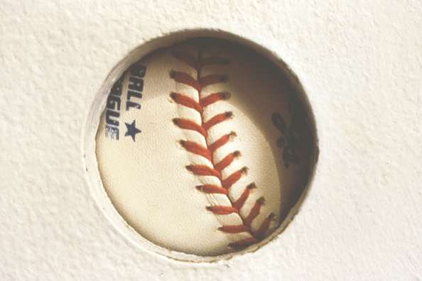 TOUCH OF GREATNESS: JOE DIMAGGIO<br/>
1994 Ongoing <br/>
Detail: Autograph Un-rotated<br/>
Autographed Baseball from the Artist's Personal Collection: Joe DiMaggio <br/>
Left Unguarded to Rotate Behind “The Hole” and Collection Viewer's Fingerprints, Diminishing in Value as a Collectible, while Increasing in Value as an Art Object <br/>
Dimensions: Regulation American League Baseball <br/>