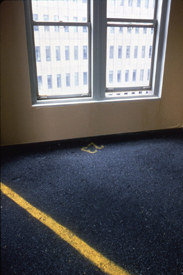  
“ASPHALT JUNGLE”: PAY HERE; NY <br/>
1991 Ongoing <br/>
Floor: Asphalt Installed on Top of Gallery Floor to Create Sections of 8 Spaces of an Abstract 100 Space Parking Lot, Parking Lines, and Numbers Painted on Asphalt to Delineate Parking Spaces <br/>
Detail: Spaces 23, 24<br/>
Regulation Standard Parking Spaces <br/>
Variable Dimensions<br/>