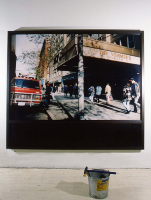 “ALL THE VERMEER'S OF NEW YORK” <br/>
1996<br/>
Eastern View<br/>
Cibachrome with Non-Glare Plexiglas Set in Street Level Window Treatment with Bucket of Water and Squeegee for Viewers to Clean “The Vermeer” <br/ >
92” x 80 1/2”<br/>