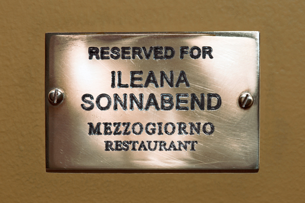 RESERVED FOR ILEANA SONNABEND: “BUDDHA OR MACHIAVELLI” <br />
(Brenda Richardson about Ileana Sonnabend as quoted by Calvin Tomkins— <i>The New Yorker</i>)<br />
2010 <br/>
C-Print of Name Plate Reserving a Table in Perpetuity for the Preeminent Art Dealer Ileana Sonnabend<br />
Mounted between Non-Glare Plexiglas Surfaces<br />
28” x 18”<br />