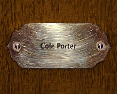 “MAMAS DON'T LET YOUR BABIES GROW UP TO BE COWBOYS”<br/>
Cole Porter<br/>
2009 ongoing <br/>
C-Print of a Name Plate Reserving a Hotel Room in Perpetuity for the Song Writing Jazz Legend, Cole Porter<br/>
Mounted on Wood with Non-Glare Plexiglas Surface<br/>
7 3/4” x 9 3/4” x 3/4” <br/>