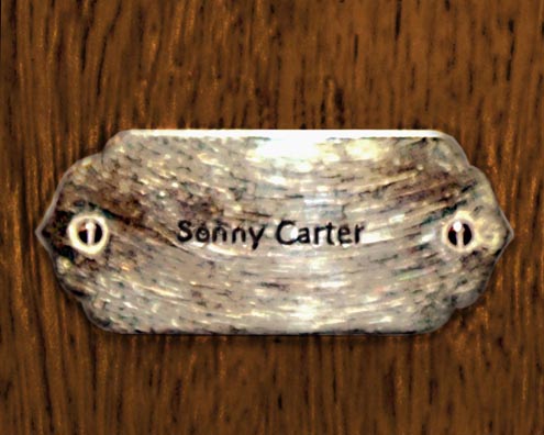 “MAMAS DON'T LET YOUR BABIES GROW UP TO BE COWBOYS”<br/>
Sonny Carter<br/>
2009 ongoing <br/>
C-Print of a Name Plate Reserving a Hotel Room in Perpetuity for the Jazz Legend, Sonny Carter<br/>
Mounted on Wood with Non-Glare Plexiglas Surface<br/>
7 3/4” x 9 3/4” x 3/4” <br/>