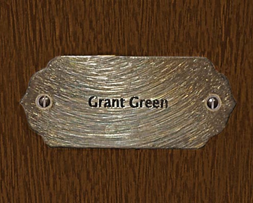 “MAMAS DON'T LET YOUR BABIES GROW UP TO BE COWBOYS”<br/>
Grant Green<br/>
2009 ongoing <br/>
C-Print of a Name Plate Reserving a Hotel Room in Perpetuity for the Guitar Jazz Legend, Grant Green<br/>
Mounted on Wood with Non-Glare Plexiglas Surface<br/>
7 3/4” x 9 3/4” x 3/4” <br/>